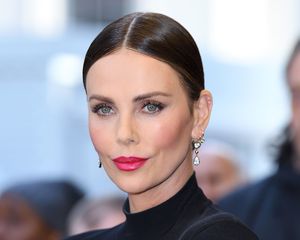 Charlize Theron wearing magenta lipstick