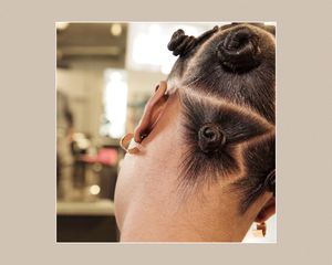 woman with bantu knots