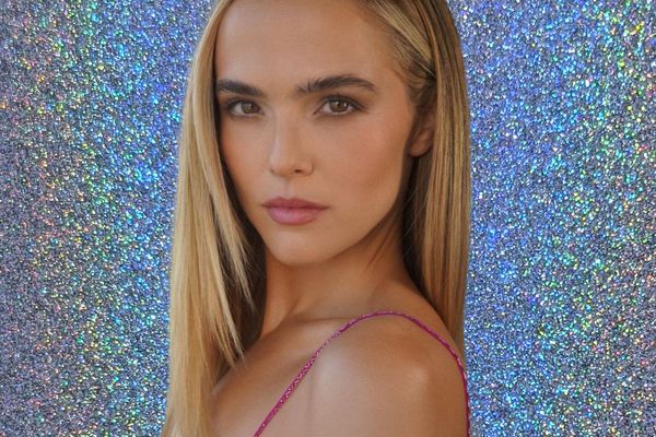 model posing in front of glitter