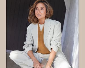 Ashley Park wearing a light suit