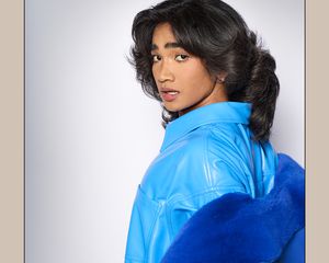 Bretman Rock in a blue jacket