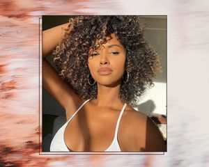 Woman with dark brown curls