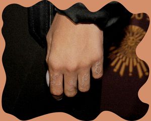 Rihanna white ink hand tattoo