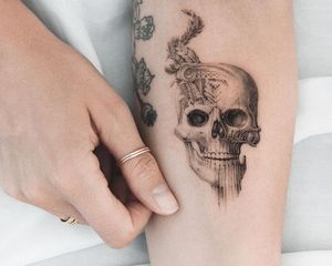 skull tattoo on a forearm