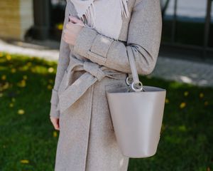 Woman with bucket bag