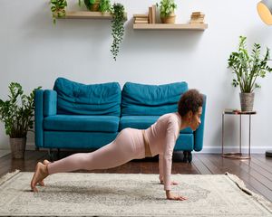 Black woman in pink yoga outfit