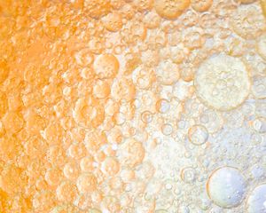 bubbles in orange liquid