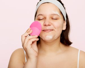 person cleansing face