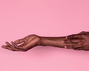 woman scratching arm