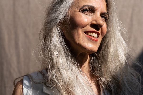 woman with silver hair smiling 