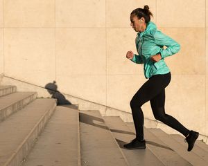 Woman runs up stairs