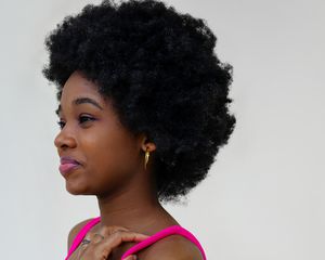 Close up of a woman with afro hair