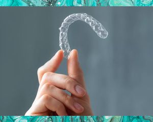 hand holding up night guard