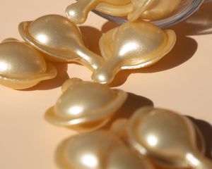 tiny capsules spilling from a jar