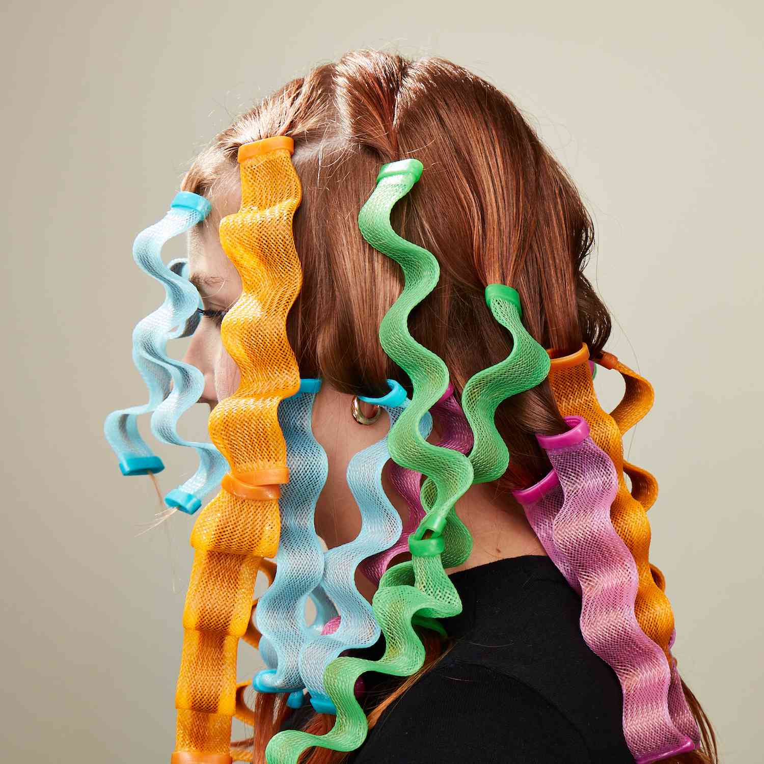 Side profile of Byrdie editor Bella Cacciatore's hair with waveformers installled