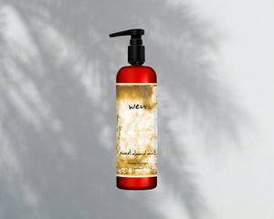 Wen Sweet Almond Mint Cleansing Conditioner on palm leaf shadow background