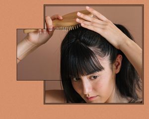 Woman brushing hair.