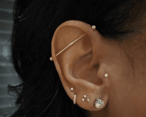 Woman with many ear piercings