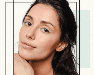 Portrait of a Woman Wearing Mint Green Graphic Winged Eyeliner 